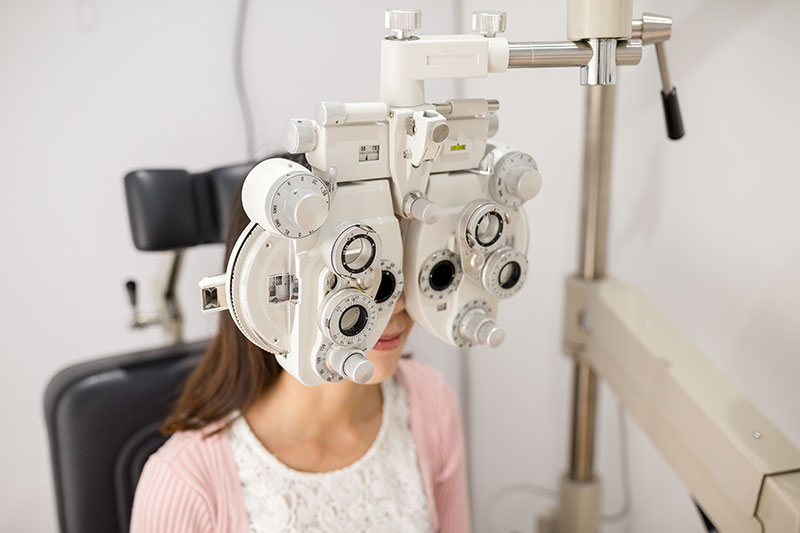 white female pediatric eye exam